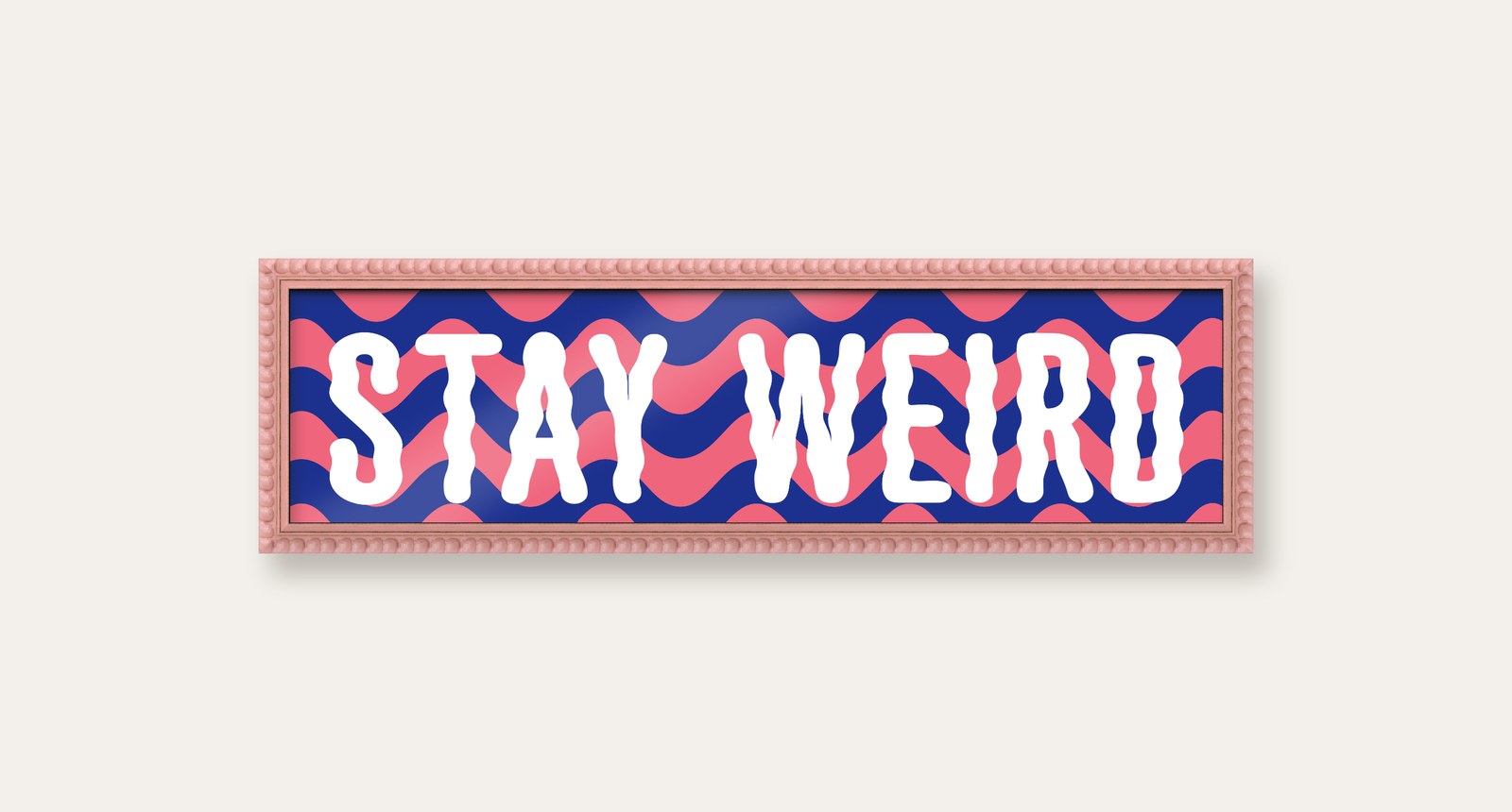 Stay Weird panoramic print in a pink bobbin frame