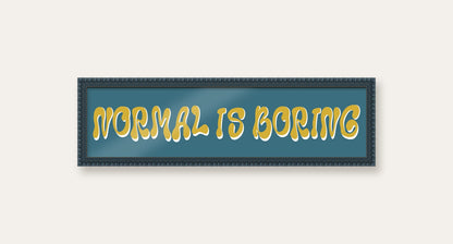 Normal Is Boring panoramic print in a midnight blue bobbin frame