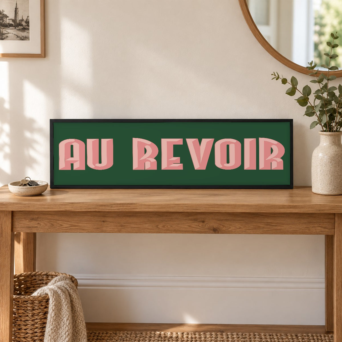 Framed Au Revoir panoramic print on a hallway console table