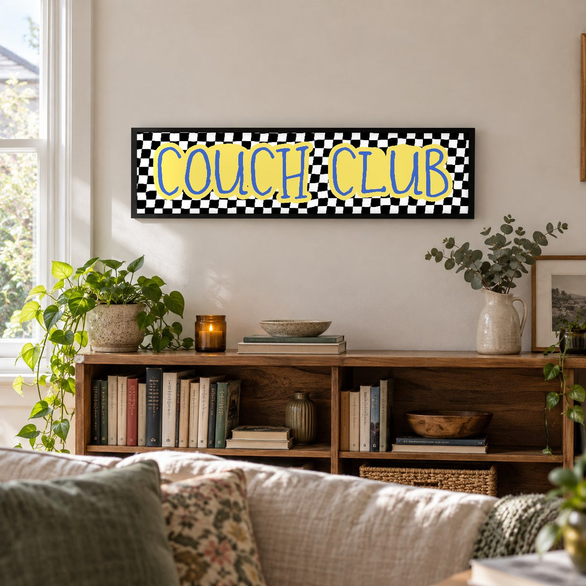 Couch Club panoramic print in a black frame in a room setting