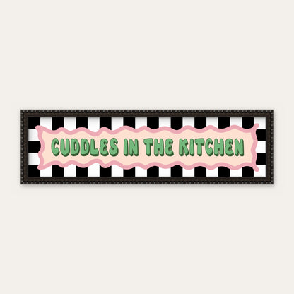 Cuddles In The Kitchen panoramic print in a black bobbin frame