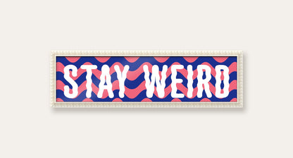 Stay Weird panoramic print in a white bobbin frame