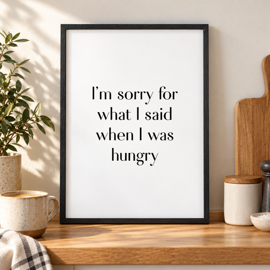 I'm Sorry For What I Said When I Was Hungry Print — close lifestyle view, black oak frame