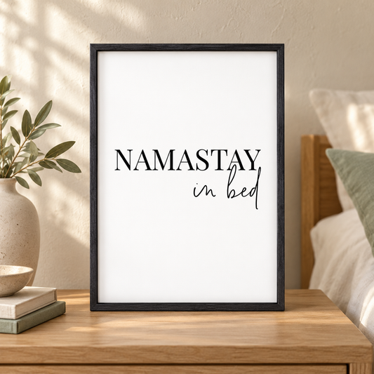 Namastay In Bed Print — close lifestyle view, black oak frame