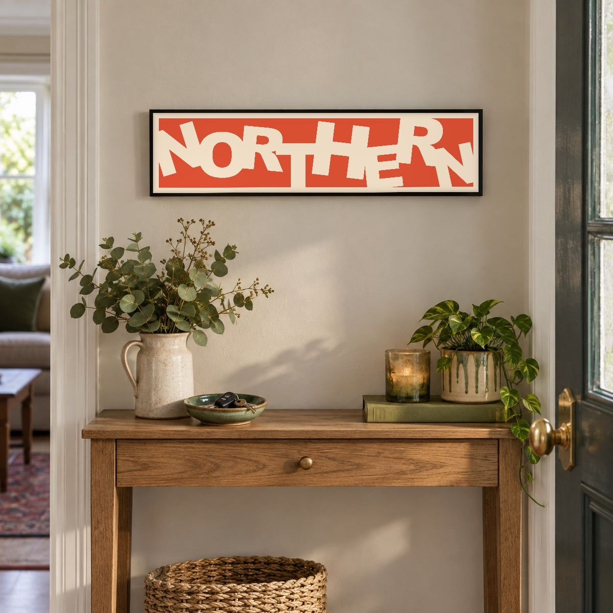 Northern panoramic print in a black frame in a room setting