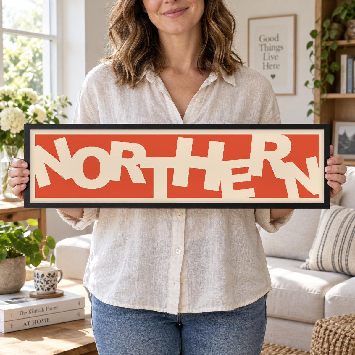 Northern panoramic print in a black frame in a room setting