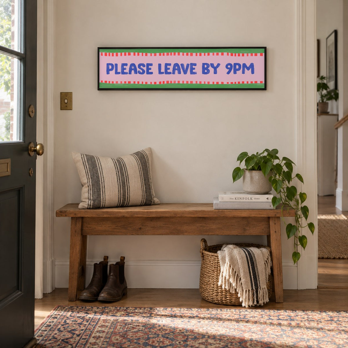 Please Leave By 9pm panoramic print in a black frame in a room setting