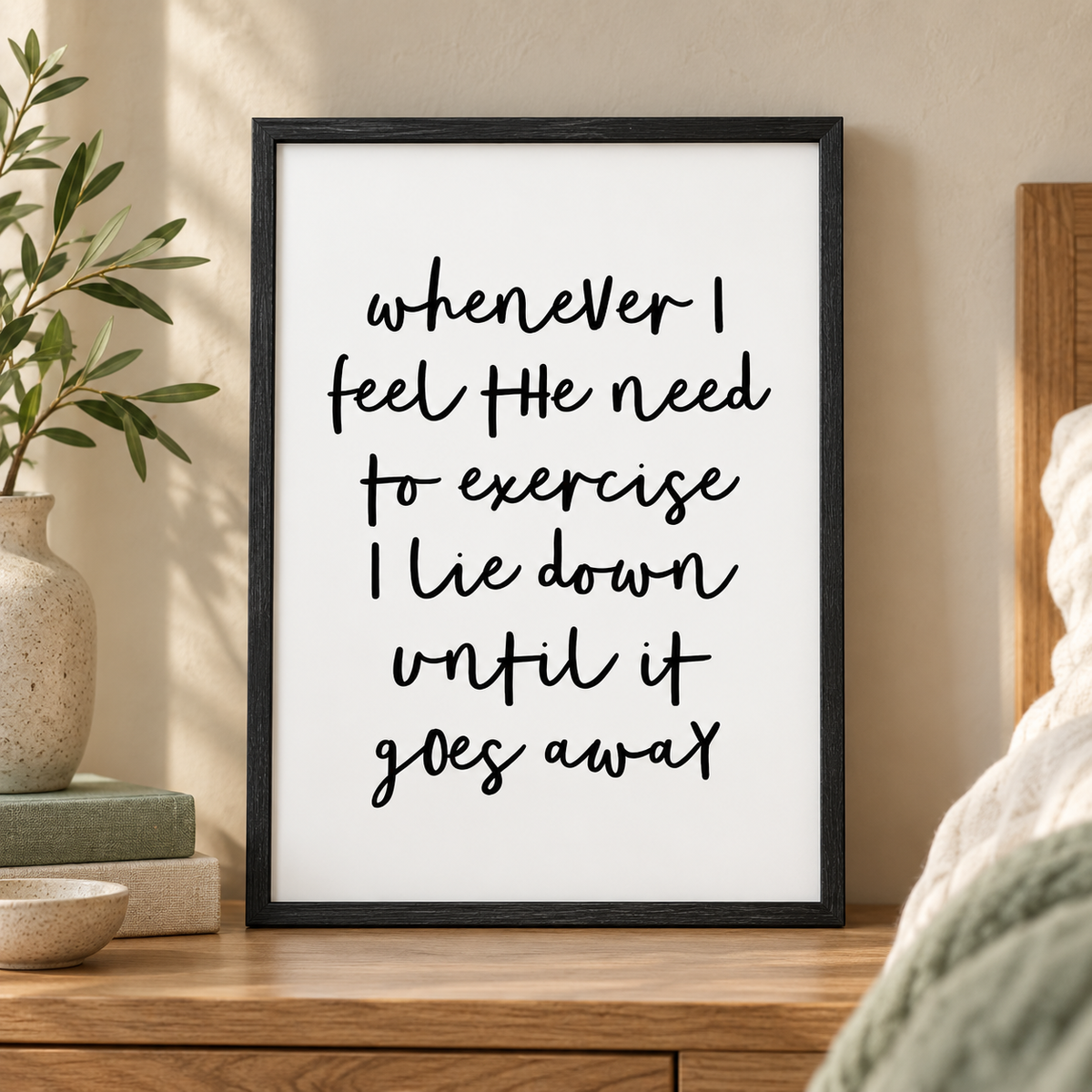 Whenever I Feel The Need To Exercise I Lie Down Until It Goes Away Print — close lifestyle view, black oak frame